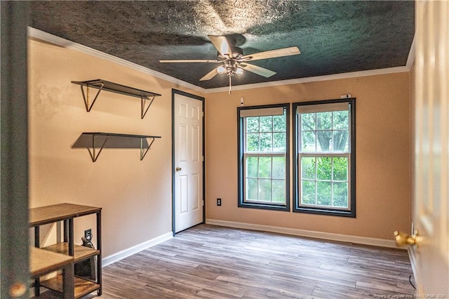 1360 Rays Bridge Rd, Whispering Pines, NC 28327 - spare room with ceiling fan, wood finished floors, and crown molding