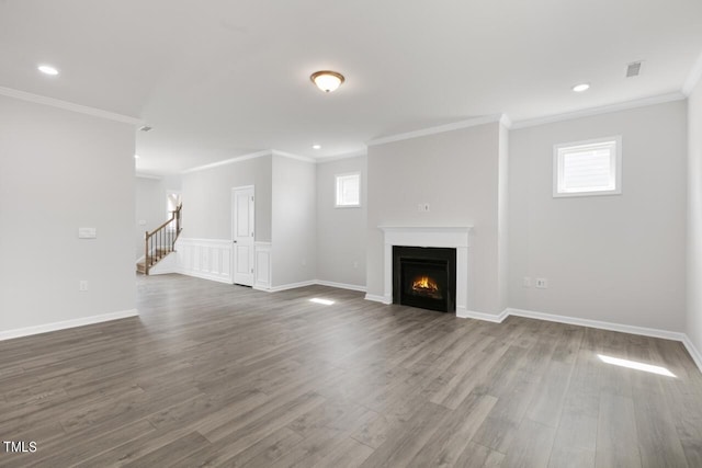 1409 Jasmine View Way, Knightdale, NC 27545 - unfurnished living room featuring wood finished floors, a lit fireplace, recessed lighting, crown molding, and stairway