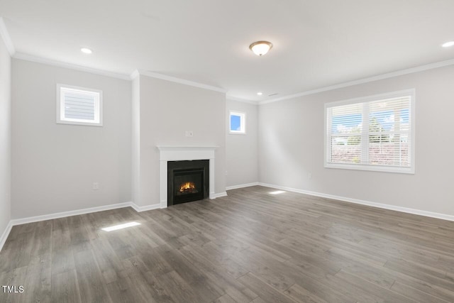 1409 Jasmine View Way, Knightdale, NC 27545 - unfurnished living room with ornamental molding, wood finished floors, a warm lit fireplace, and recessed lighting