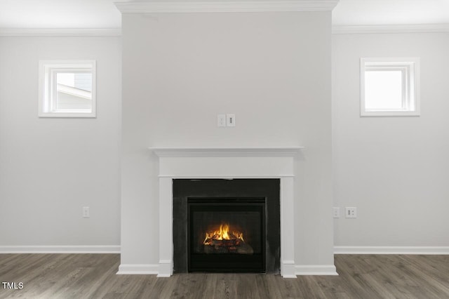 1409 Jasmine View Way, Knightdale, NC 27545 - detailed view of wood finished floors, a lit fireplace, and crown molding