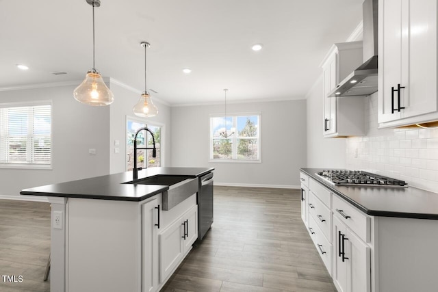 1409 Jasmine View Way, Knightdale, NC 27545 - kitchen featuring wall chimney exhaust hood, stainless steel appliances, dark countertops, wood finished floors, and ornamental molding