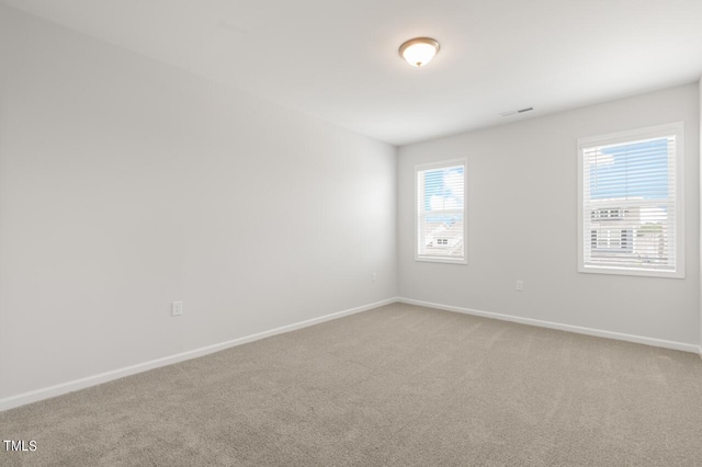 1409 Jasmine View Way, Knightdale, NC 27545 - spare room with light carpet and baseboards