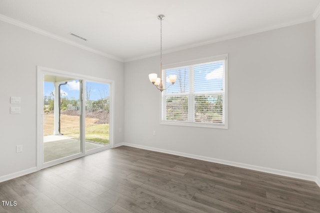 1409 Jasmine View Way, Knightdale, NC 27545 - spare room with a chandelier, ornamental molding, healthy amount of natural light, and dark wood-style flooring