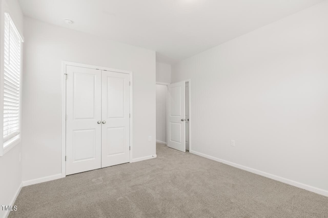 1409 Jasmine View Way, Knightdale, NC 27545 - unfurnished bedroom featuring carpet and a closet
