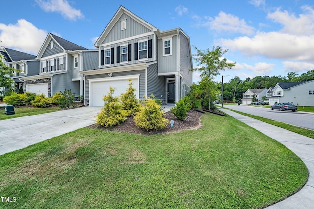 1143 Sweet Cream Ct, Durham, NC 27703 - traditional-style home with concrete driveway, an attached garage, board and batten siding, a front yard, and a residential view