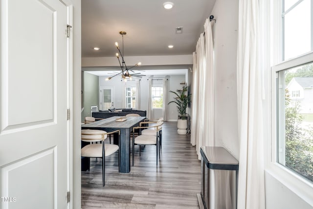 1143 Sweet Cream Ct, Durham, NC 27703 - dining space featuring wood finished floors, recessed lighting, and a chandelier