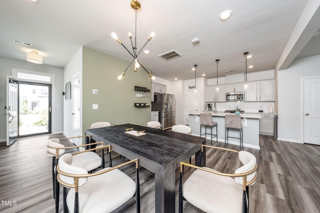1143 Sweet Cream Ct, Durham, NC 27703 - dining space featuring dark wood-type flooring and recessed lighting