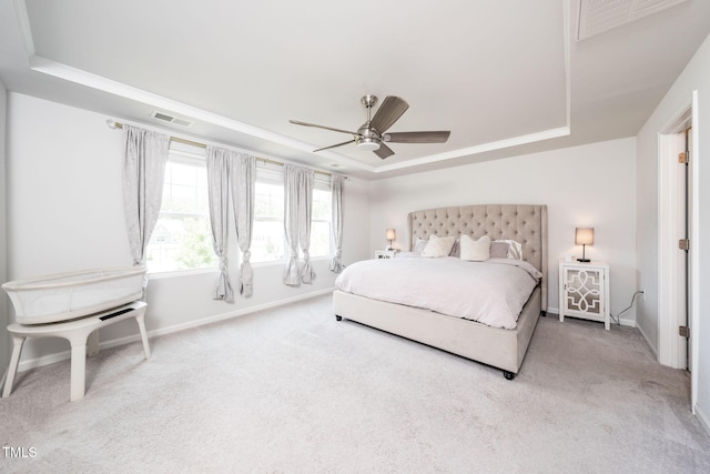 1143 Sweet Cream Ct, Durham, NC 27703 - bedroom with a tray ceiling, carpet, and ceiling fan