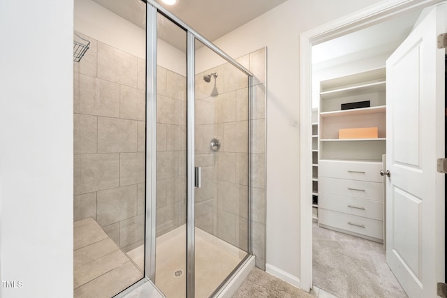 1143 Sweet Cream Ct, Durham, NC 27703 - bathroom with a walk in closet and a shower stall
