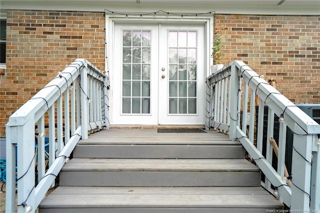 4450 Chesterbrook Dr, Fayetteville, NC 28314 - doorway to property with french doors, brick siding, and a deck