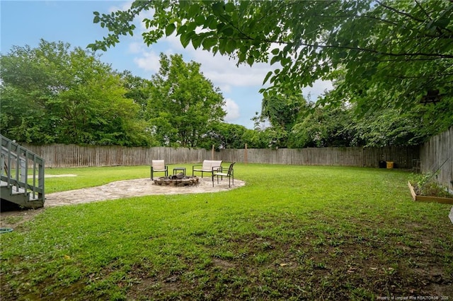 4450 Chesterbrook Dr, Fayetteville, NC 28314 - fenced backyard with a fire pit and a patio area