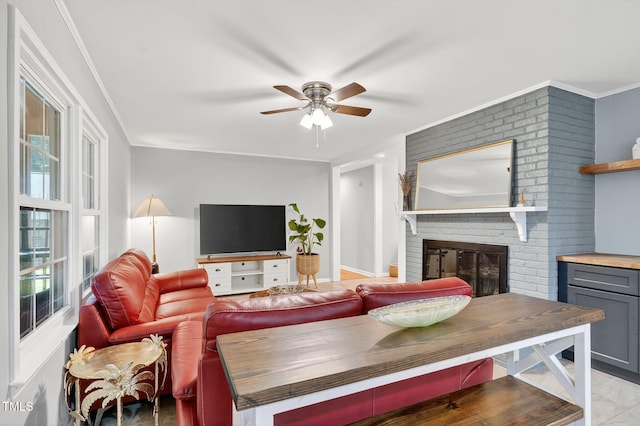 213 SE Maynard Rd, Cary, NC 27511 - living area featuring ceiling fan, a brick fireplace, and ornamental molding