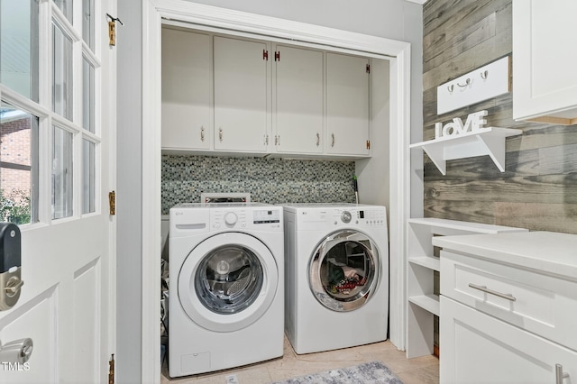 213 SE Maynard Rd, Cary, NC 27511 - laundry area featuring cabinet space, washer and clothes dryer, and light tile patterned floors