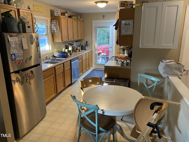 232 Fairview Rd, Cary, NC 27511 - kitchen with appliances with stainless steel finishes, plenty of natural light, light countertops, and light floors
