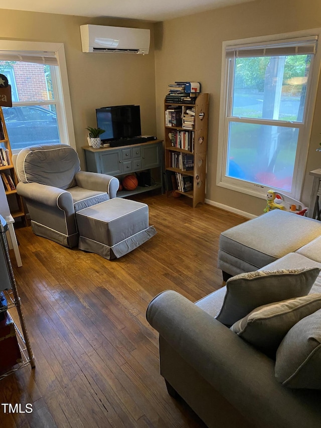 232 Fairview Rd, Cary, NC 27511 - living room with a wall unit AC and hardwood / wood-style floors