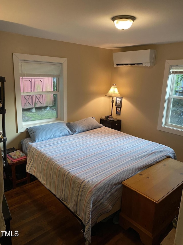 232 Fairview Rd, Cary, NC 27511 - bedroom with an AC wall unit and wood finished floors