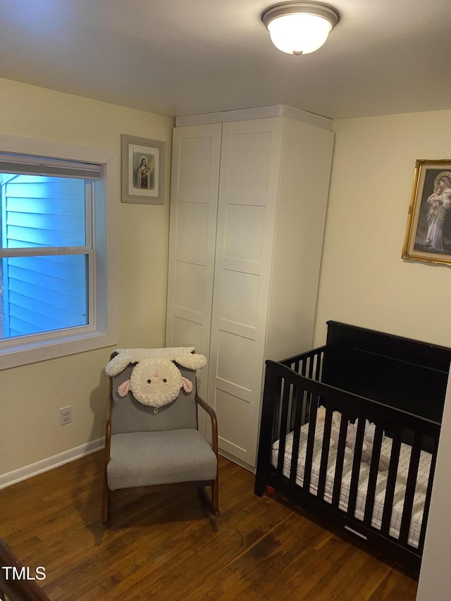 232 Fairview Rd, Cary, NC 27511 - bedroom with wood finished floors and a crib