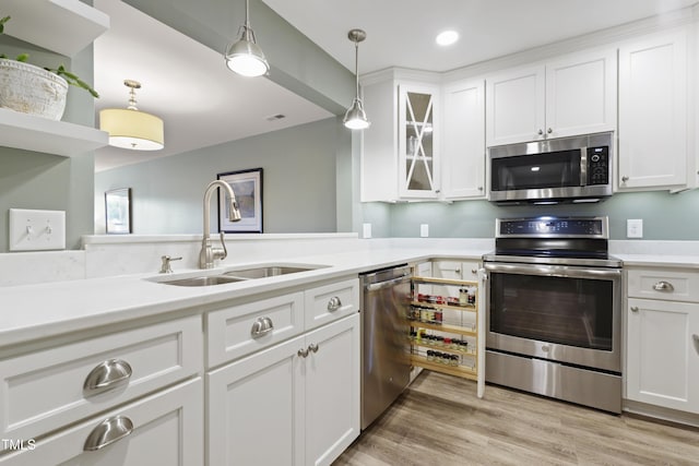720 Springfork Dr, Cary, NC 27513 - kitchen featuring stainless steel appliances, hanging light fixtures, white cabinets, light countertops, and recessed lighting
