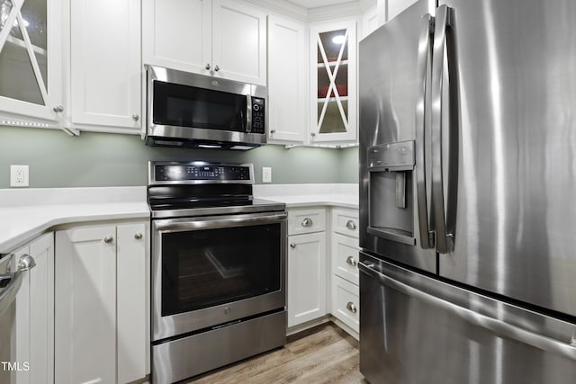 720 Springfork Dr, Cary, NC 27513 - kitchen with appliances with stainless steel finishes, light countertops, and white cabinets