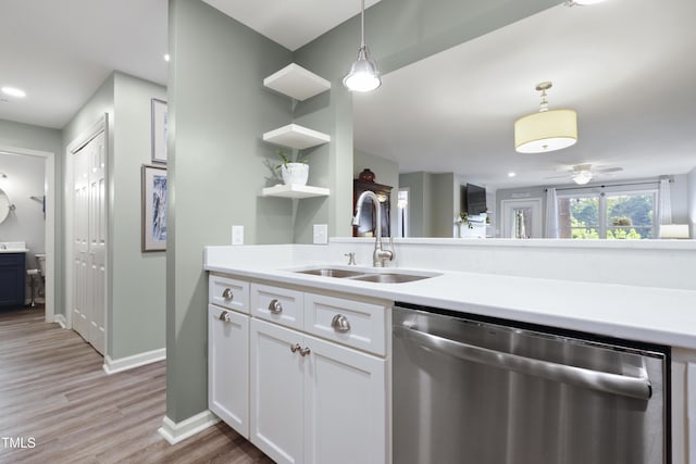 720 Springfork Dr, Cary, NC 27513 - kitchen with dishwasher, pendant lighting, light countertops, light wood-style floors, and recessed lighting
