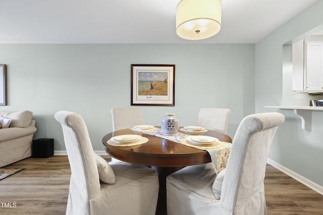 720 Springfork Dr, Cary, NC 27513 - dining room with wood finished floors and baseboards