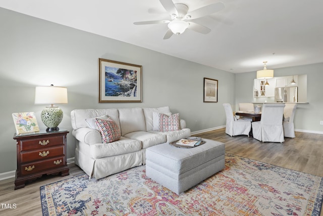 720 Springfork Dr, Cary, NC 27513 - living area featuring wood finished floors and a ceiling fan