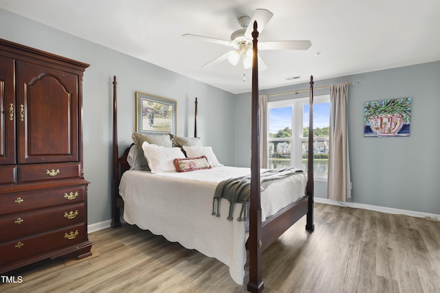 720 Springfork Dr, Cary, NC 27513 - bedroom featuring light wood finished floors and ceiling fan