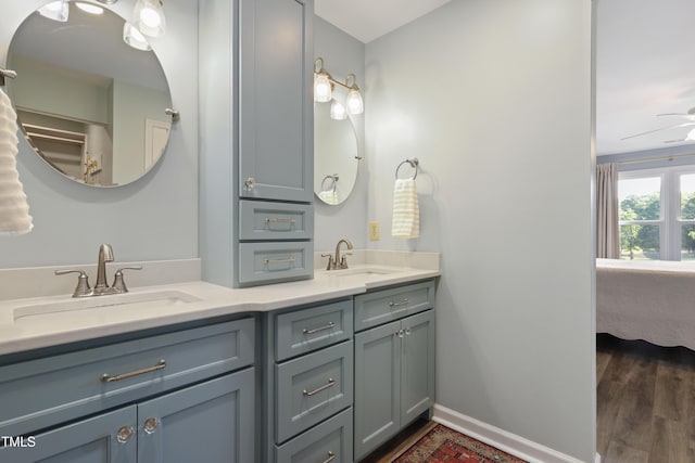 720 Springfork Dr, Cary, NC 27513 - bathroom featuring double vanity, ensuite bathroom, and wood finished floors