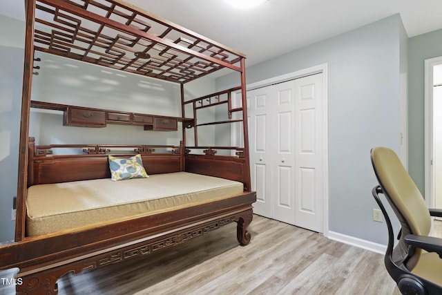 720 Springfork Dr, Cary, NC 27513 - bedroom with wood finished floors and a closet