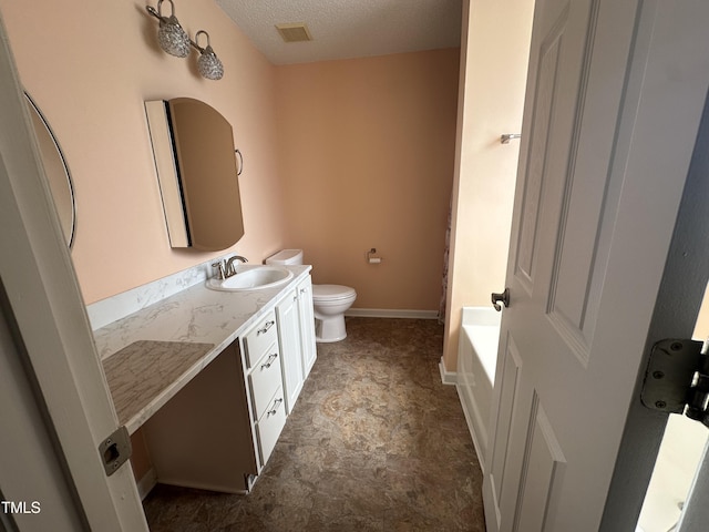 216 Parrish Farm Ln, Benson, NC 27504 - bathroom with vanity, a textured ceiling, and a tub to relax in