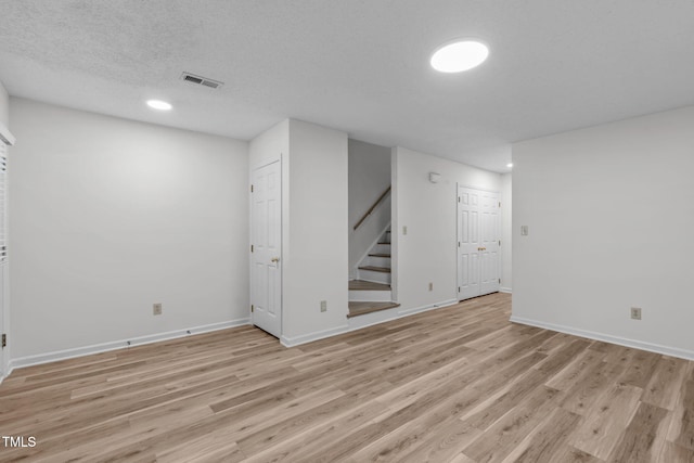 82 Forest Oaks Dr, Durham, NC 27705 - basement with stairs, light wood-type flooring, and recessed lighting