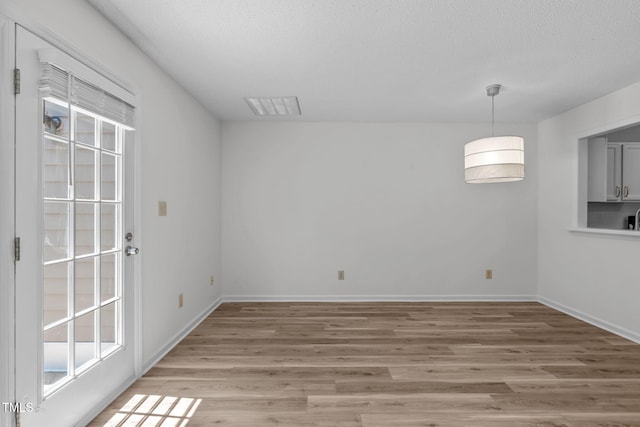82 Forest Oaks Dr, Durham, NC 27705 - unfurnished room featuring light wood finished floors and a textured ceiling