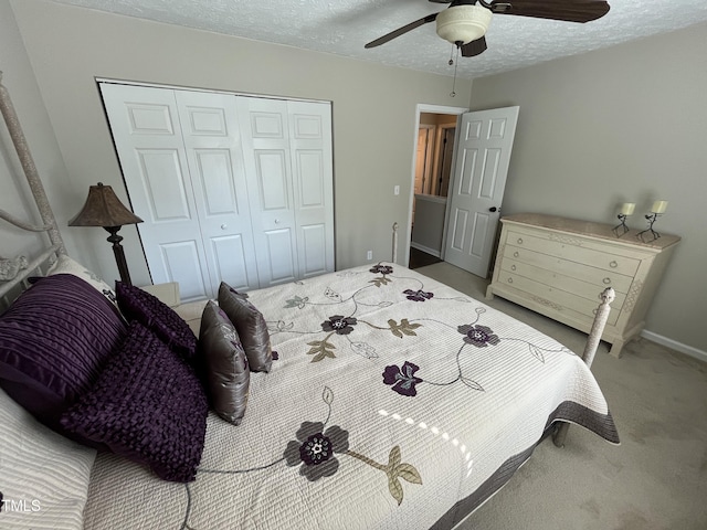 106 Carmel Woods Ct, Wake Forest, NC 27587 - bedroom with a closet, carpet, a textured ceiling, and ceiling fan