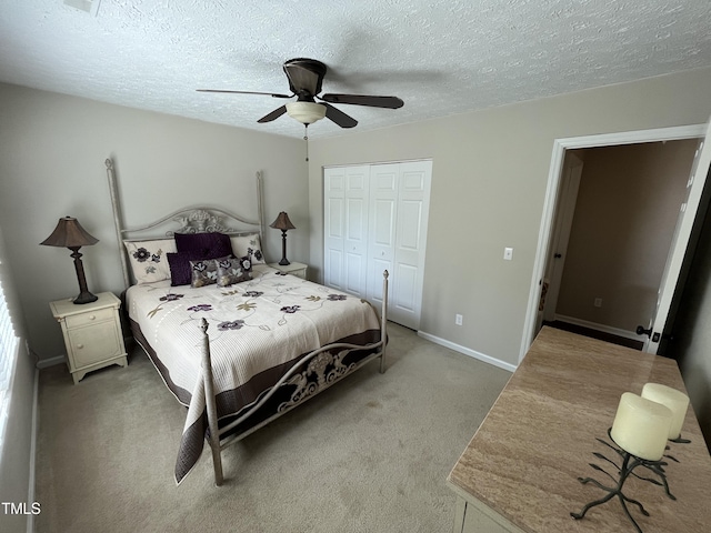 106 Carmel Woods Ct, Wake Forest, NC 27587 - bedroom featuring light colored carpet, a closet, a ceiling fan, and a textured ceiling