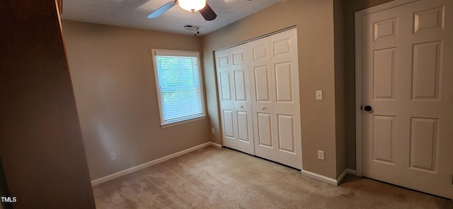 106 Carmel Woods Ct, Wake Forest, NC 27587 - unfurnished bedroom featuring light carpet, a closet, ceiling fan, and a textured ceiling