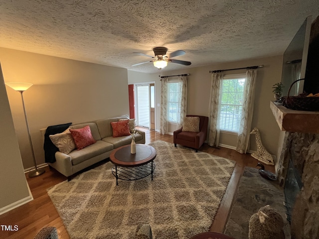 106 Carmel Woods Ct, Wake Forest, NC 27587 - living area featuring plenty of natural light, ceiling fan, wood finished floors, and a textured ceiling