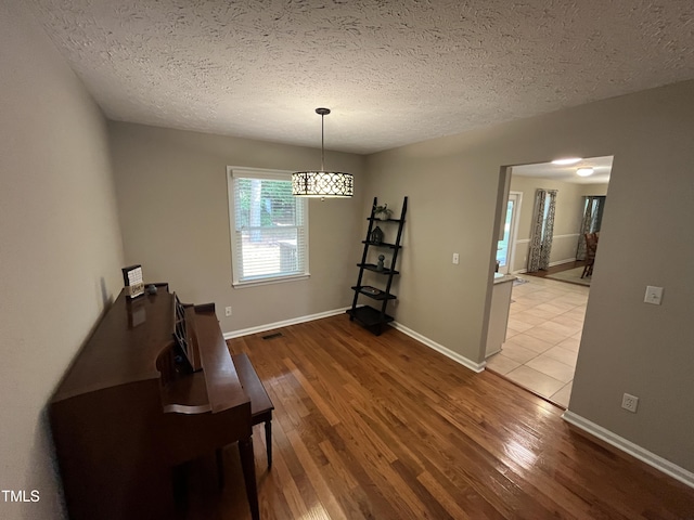 106 Carmel Woods Ct, Wake Forest, NC 27587 - sitting room featuring wood finished floors and a textured ceiling