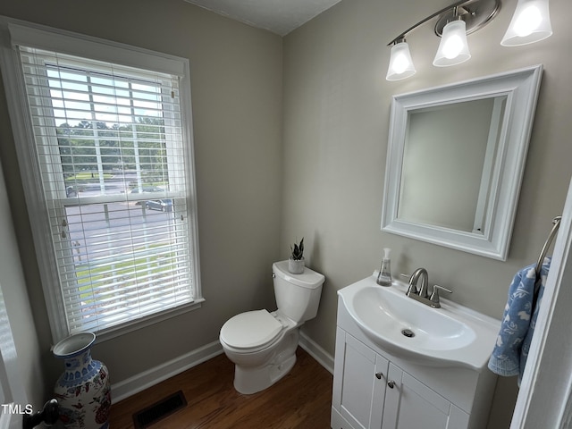 106 Carmel Woods Ct, Wake Forest, NC 27587 - half bathroom with vanity and wood finished floors