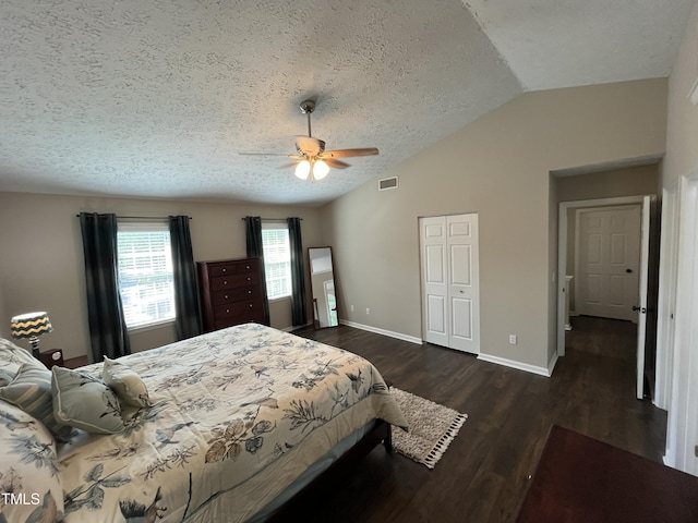 106 Carmel Woods Ct, Wake Forest, NC 27587 - bedroom featuring lofted ceiling, a textured ceiling, dark wood-style flooring, a closet, and a ceiling fan