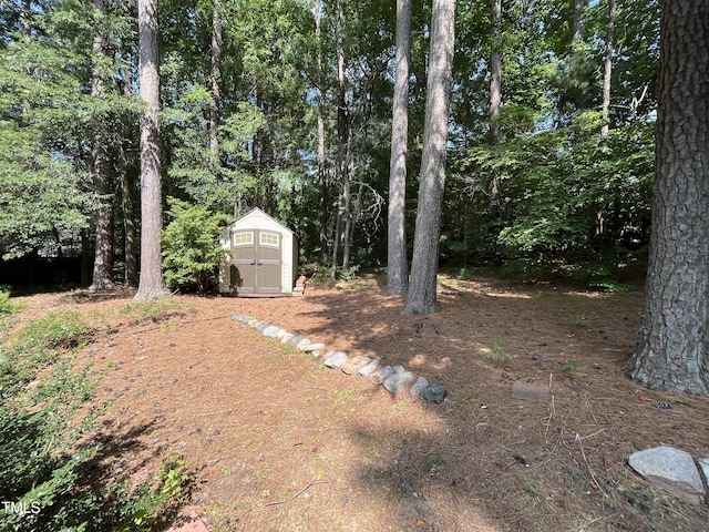 106 Carmel Woods Ct, Wake Forest, NC 27587 - view of yard featuring a storage shed