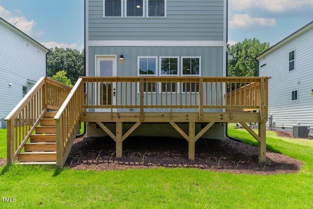 136 E End Ave, Durham, NC 27703 - rear view of house featuring board and batten siding, a wooden deck, and a lawn