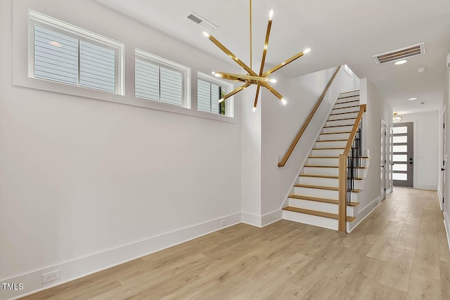 136 E End Ave, Durham, NC 27703 - staircase with a chandelier, wood finished floors, plenty of natural light, and recessed lighting