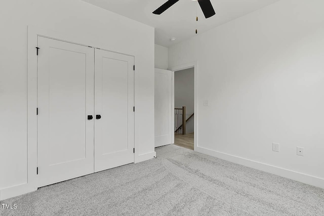 136 E End Ave, Durham, NC 27703 - unfurnished bedroom featuring a closet, carpet, and a ceiling fan