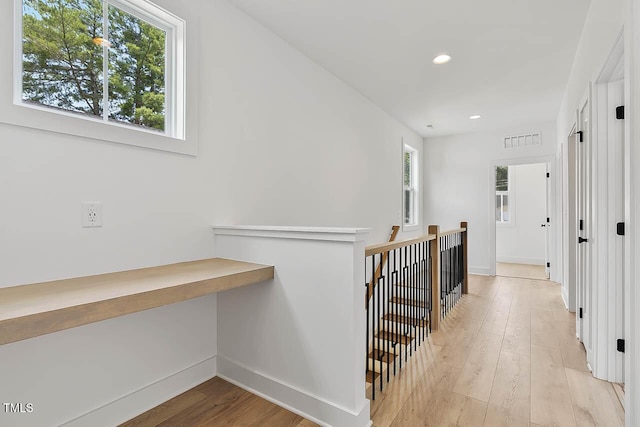 136 E End Ave, Durham, NC 27703 - hallway with light wood finished floors, recessed lighting, an upstairs landing, and an office area