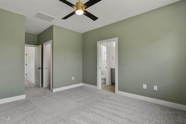 136 E End Ave, Durham, NC 27703 - unfurnished bedroom with carpet flooring, ensuite bath, and ceiling fan