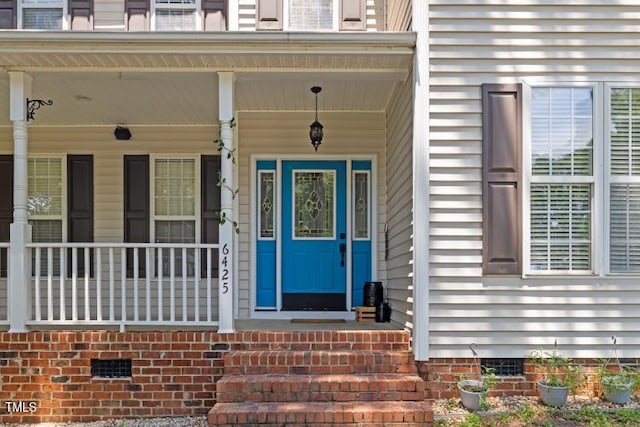 6425 Cross Ridge Dr, Holly Springs, NC 27540 - property entrance featuring crawl space and a porch