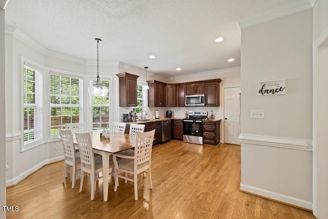 6425 Cross Ridge Dr, Holly Springs, NC 27540 - dining area with crown molding, light wood-style flooring, and recessed lighting