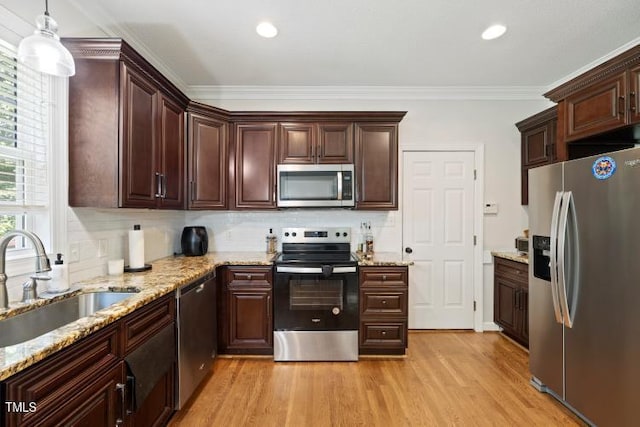 6425 Cross Ridge Dr, Holly Springs, NC 27540 - kitchen featuring stainless steel appliances, light wood-style floors, decorative backsplash, ornamental molding, and light stone countertops