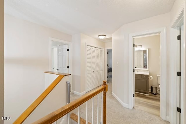 6425 Cross Ridge Dr, Holly Springs, NC 27540 - corridor with an upstairs landing and light carpet