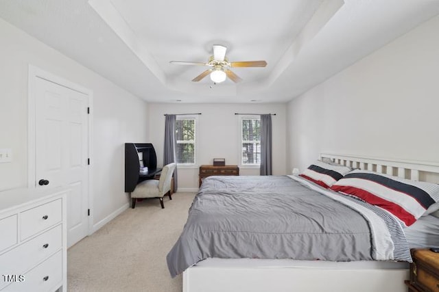 6425 Cross Ridge Dr, Holly Springs, NC 27540 - bedroom featuring light carpet, a raised ceiling, and a ceiling fan